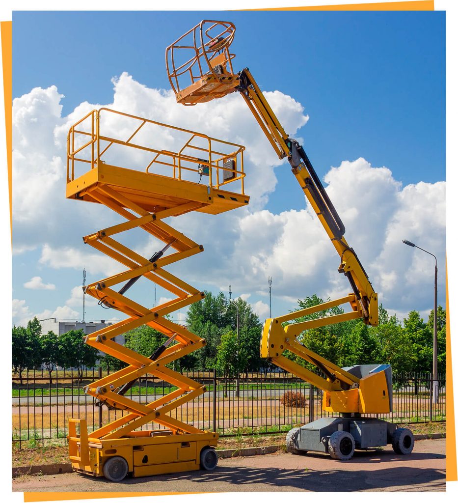 a large yellow scissor sitting on top of a parking lot.