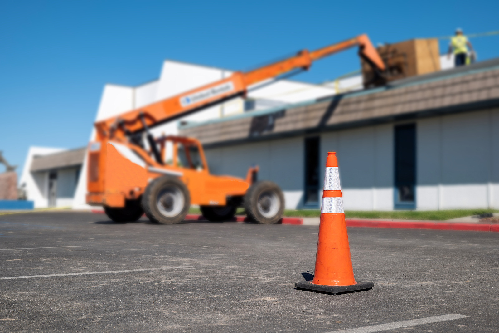 Traffic cone next to forklift